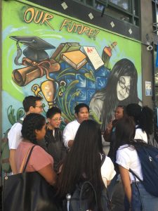Diverse Coro Students Under Our Future Mural